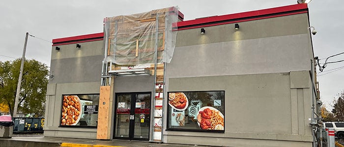 commercial spray painting on building | PREX INC.