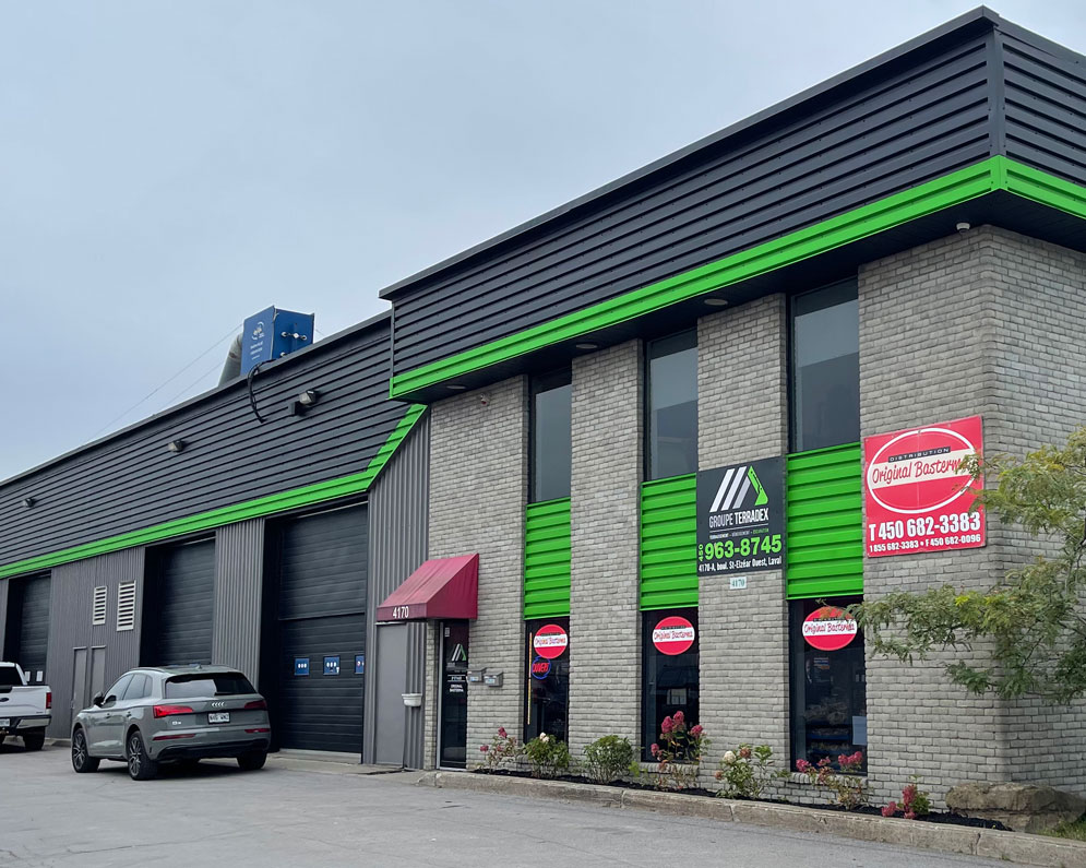 commercial spray painting on building | PREX INC.