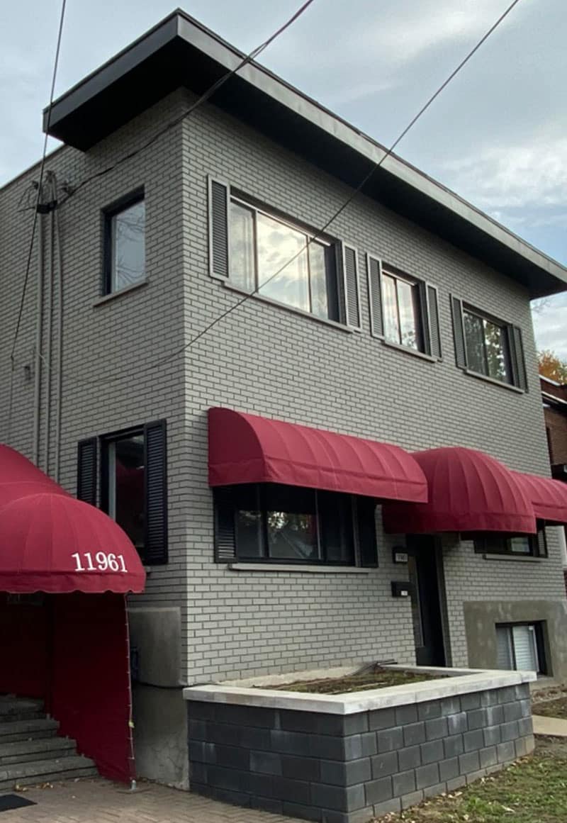 commercial spray painting on building | PREX INC.
