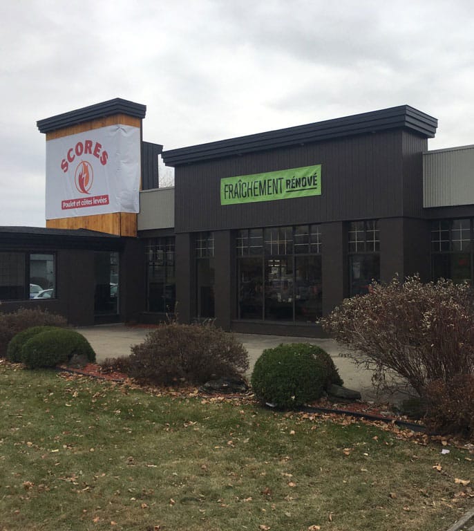 commercial spray painting on building | PREX INC.