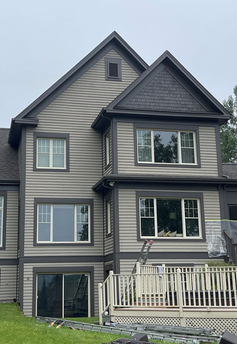 exterior house painter working on house | PREX INC.