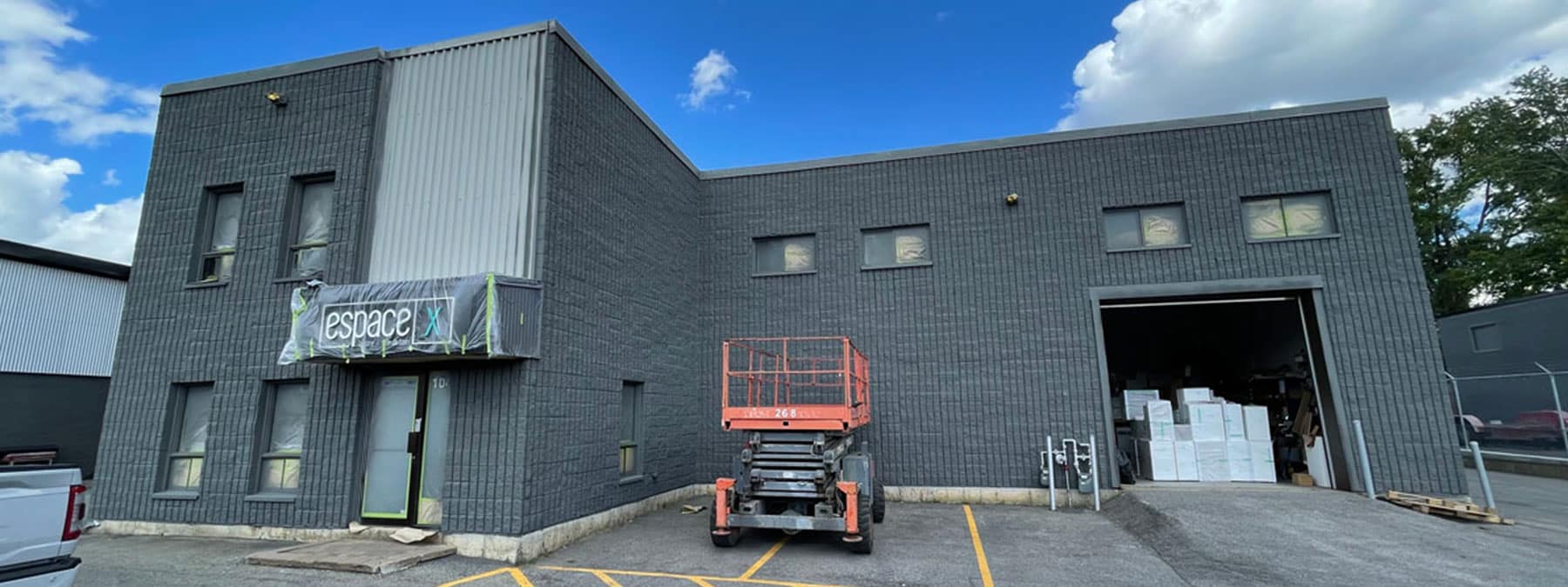 commercial spray painting on building | PREX INC.